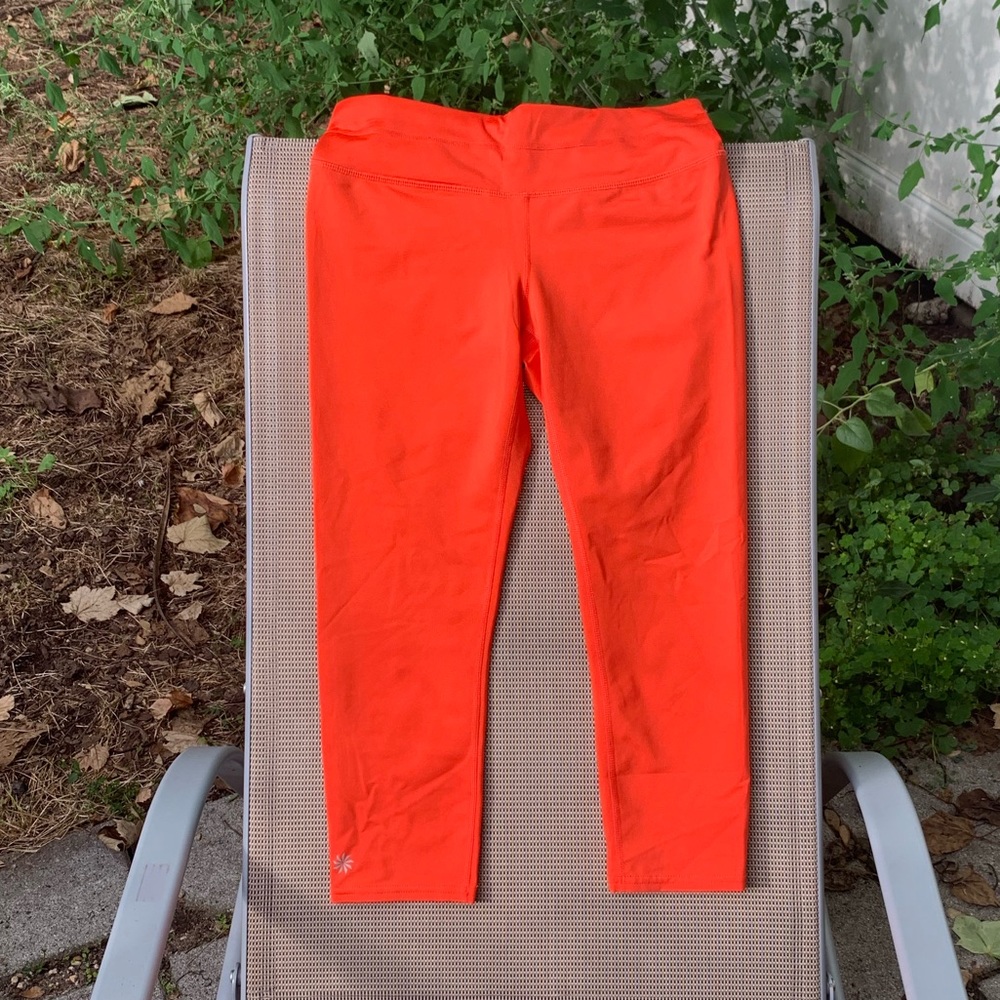 Athlete velocity stash pocket crop in orange